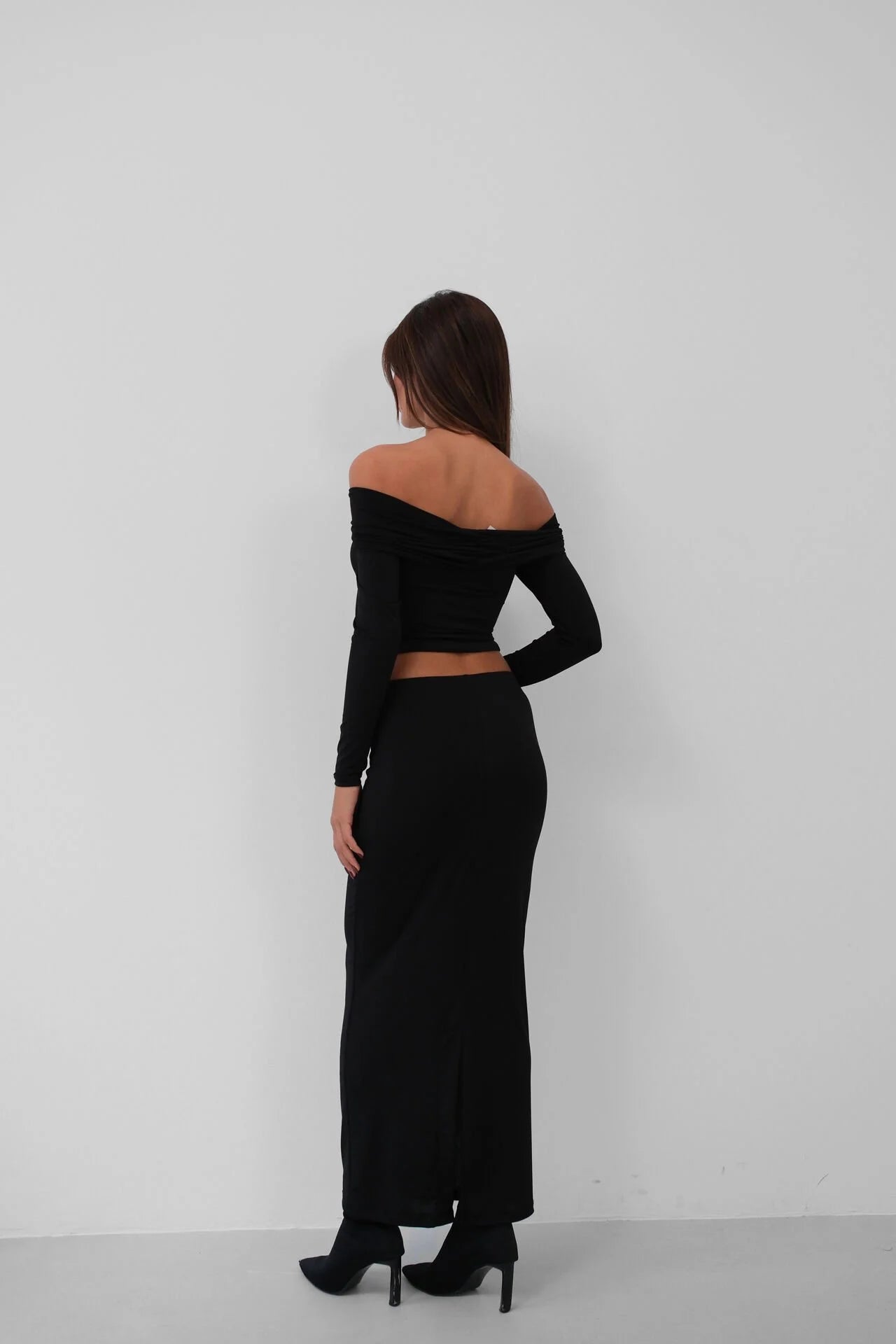 Ruched strapless black blouse.